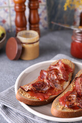 Sandwiches with peanut butter, strawberry jam and bacon