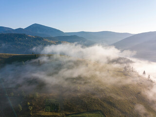 Morning fog in the Ukrainian Carpathians. Aerial drone view.