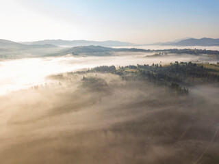 Morning fog in the Ukrainian Carpathians. Aerial drone view.