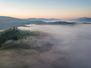 Morning fog in the Ukrainian Carpathians. Aerial drone view.