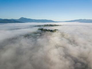 Morning fog in the Ukrainian Carpathians. Aerial drone view.