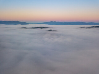 Morning fog in the Ukrainian Carpathians. Aerial drone view.