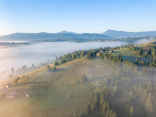 Morning fog in the Ukrainian Carpathians. Aerial drone view.