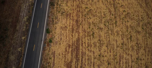 Fototapeten Aerial top down view of  road in rural area, countryside. © Hand Robot