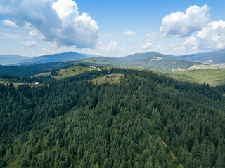 Green mountains of Ukrainian Carpathians in summer. Sunny day. Aerial drone view.