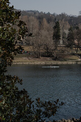 People kayaking on the Po river in Italy. People enjoying outdoors, doing sports.