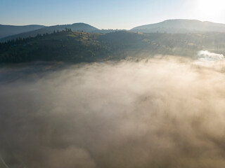 Morning fog in the Ukrainian Carpathians. Aerial drone view.