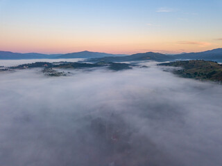 Morning fog in the Ukrainian Carpathians. Aerial drone view.