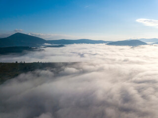 Fototapeta premium Morning fog in the Ukrainian Carpathians. Aerial drone view.