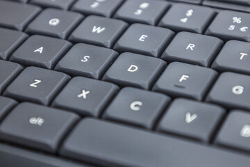 Closeup shot of a modern black computer keyboard