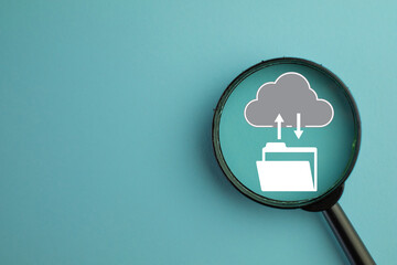 Cloud technology,computing concept.,Magnifying glass with  file transfer to cloud system icon over...