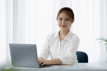 Beautiful Asian woman is a businesswoman who leads a new generation of startups, a woman who runs and manages a business plan to build confidence and stability in business, woman-led business concept.