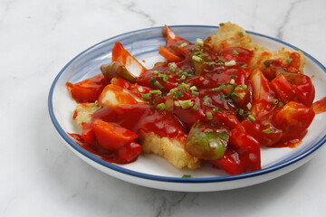 Freshly cooked fish in sweet and sour sauce