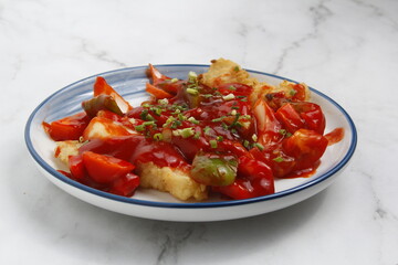 Freshly cooked fish in sweet and sour sauce