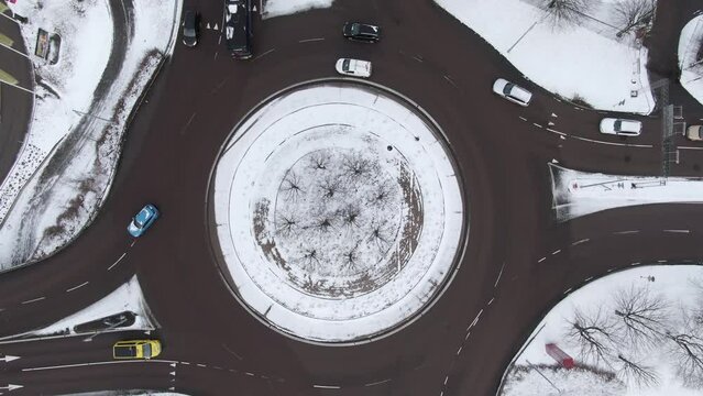 Top down ascending view over roundabout of Boras city covered with snow. Sweden