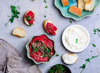 Beetroot hummus with micro greens. top view .