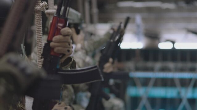 Group of Soldiers or Special Forces Loading weapons and installing Magazine Before Fight . Military , war or strike ball theme concept . Shot on ARRI Alexa cinema camera in Slow Motion . Close up view