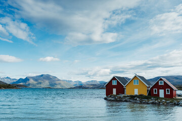 Row of cute cabins at a Norwegian fjord