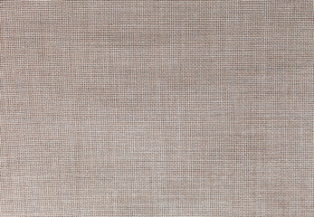 Close up view of a special canvas with square holes for cross-stitching or artistic needlework....