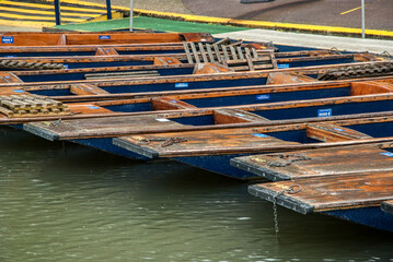 Fototapeta na wymiar Punt flat bottom river wooden boats on river Cam waters in Cambridge