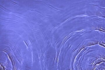 Transparent purple water surface texture with ripples, splashes and bubbles. Abstract nature...