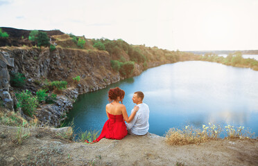 Gentle hugs of the couple in love on a beautiful nature background
