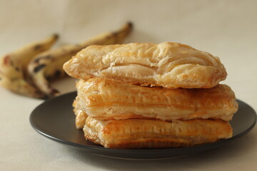 Plantain puff. Ripe plantain slices wrapped in a puff pastry sheets and baked until crisp