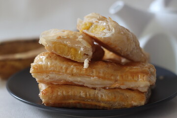 Plantain puff. Ripe plantain slices wrapped in a puff pastry sheets and baked until crisp