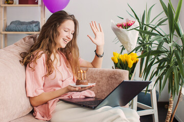 Happy young woman virtual meeting birthday party online  with laptop