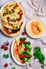Hummus with fresh vegetable salad. top view .
