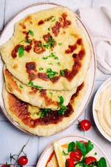 Hummus with fresh vegetable salad. top view .