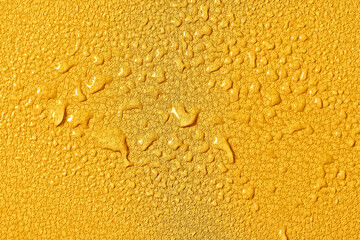Bright yellow water-repellent fabric of furniture or clothing, covered with drops of moisture....