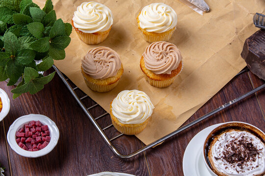 Cupcakes. Freshly baked cupcakes with coffee and small forest fruits. Food photography