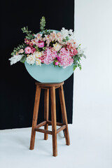 Bouquet of stylish flowers. Romantic composition with pink flowers. Pastel plants composition