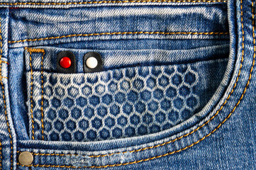 Blue jeans front pocket for fashion background, close-up. Original print on the pocket in the form...