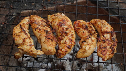 meat of chicken on the grill