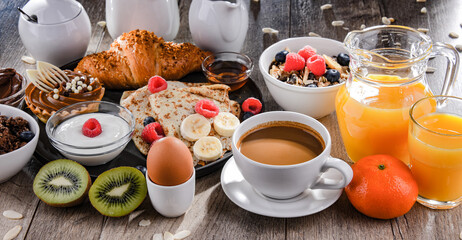 Breakfast served with coffee, juice, pancakes and croissants