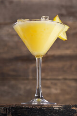 Alcoholic citrus drink in a glass, cocktail. Photography of drinks on a dark background