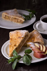 Apple pie with mint, sweetness. Food photography, dark background