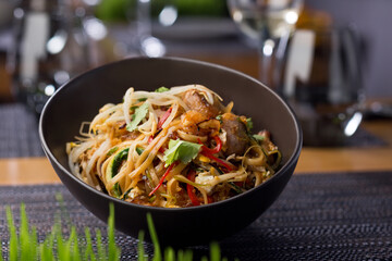 Pasta with vegetables and meat. food photography, dark background