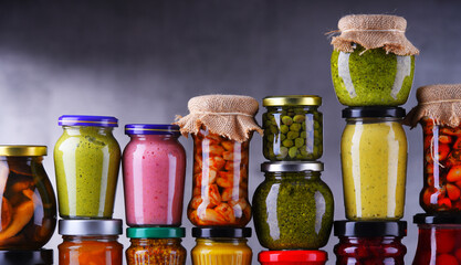 Jars with variety of pickled vegetables and fruits