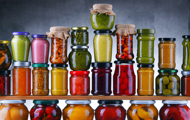 Jars with variety of pickled vegetables and fruits