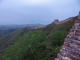 A panoramic view on an unrenewed Gubeikou part of Great Wall of China. The wall is spreading on...