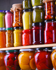 Jars with variety of pickled vegetables and fruits