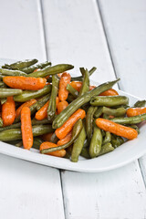 Asparagus with carrots. Photo of food on a light background