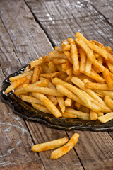 Fried french fries, fast food. Photo of food on a light background