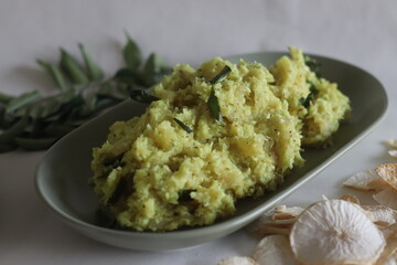 Mashed dry casava or dry tapioca. Boil the soaked dry tapioca and mash it with a mixture of grated...