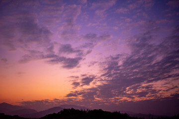 Purplish orange sky with clouds shot in an evening in Hong Kong