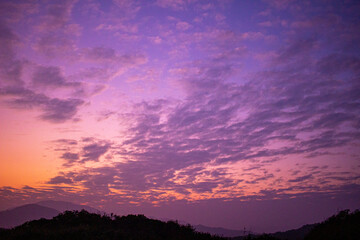 Purplish orange sky with clouds shot in an evening in Hong Kong