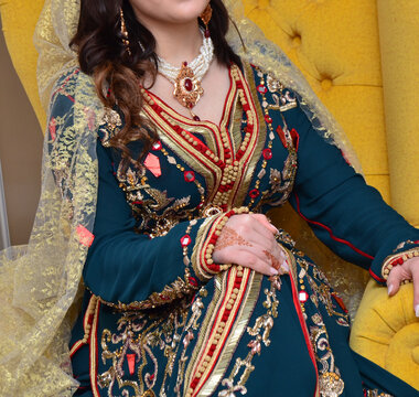 Moroccan traditional dress, embroidery on the caftan. Festive women's clothing in Morocco.